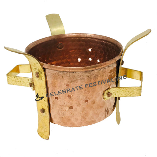 Elegant copper and brass angithi for keeping food warm on the dinner table