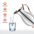 Stainless steel water jug with hand-hammered design, copper handle, and ice catcher