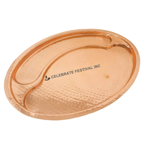 Traditional hammered copper oval Thali on white background