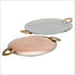 Elegant copper and steel round griddle with carved brass handles