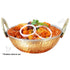 Copper and stainless steel hammered kadai bowl in use, filled with aromatic Indian curry