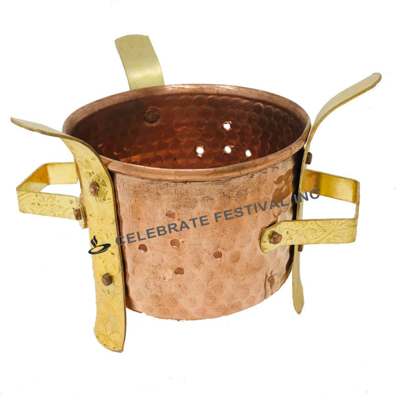Elegant copper and brass angithi for keeping food warm on the dinner table