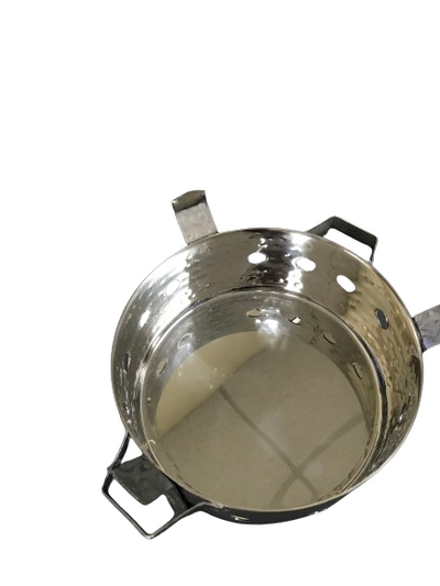 Traditional Indian sigdi used to serve hot dal and curry