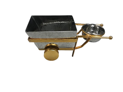 Elegant stainless steel serving trolley with golden-colored wheels for modern presentations