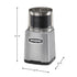 Waring commercial grinder grinding wet ingredients like garlic and ginger in clear-lid stainless steel bowl