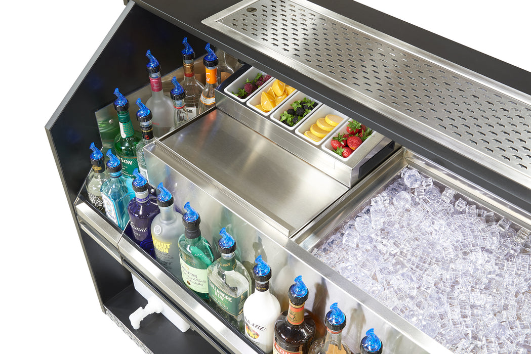 Bar cart with bottles, snacks, and ice in a well-lit setting