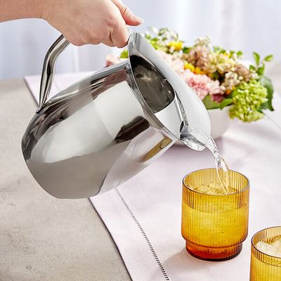 Polished stainless steel water jug with ergonomic handle and spout