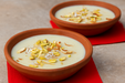 Eco-friendly clay dessert bowl with kheer garnished with dry fruits