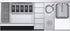 Stainless steel kitchen appliance with various components including a sink, cooktop, and storage drawers.