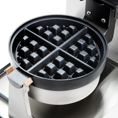 Open Winco BWM-07 waffle maker with non-stick 7-inch circular plates visible
