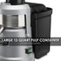 Waring WJX80 juice extractor with full pulp container and juicing in progress