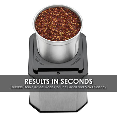 Top view of Waring spice grinder filled with whole peppercorns in stainless steel grinding cup